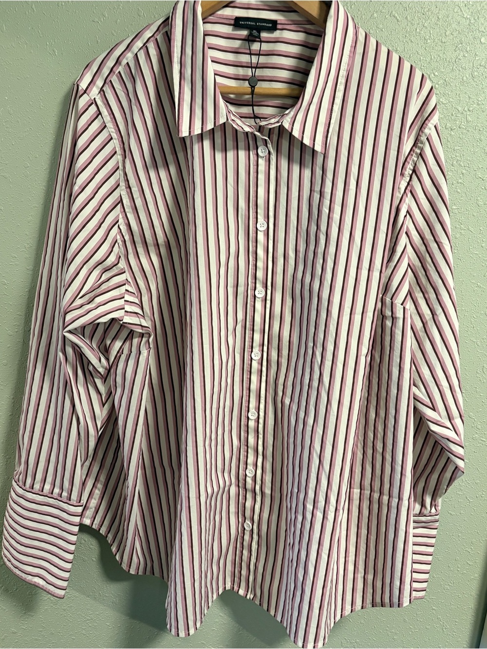 Universal Standard button down shirt cuffed sleeves